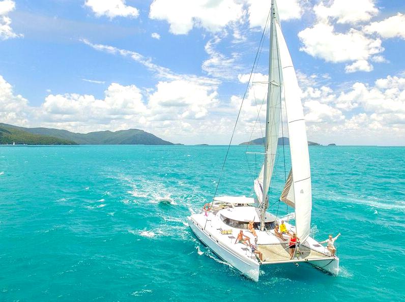 Luxury Catamaran to Whitehaven Beach: Cruising to Whitehaven Beach on a luxury catamaran.