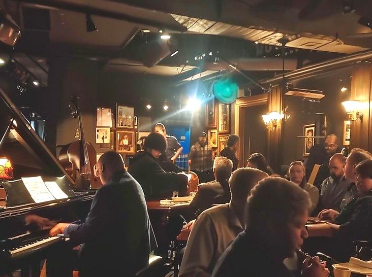 Jazz Night at a Beachfront Bar: Enjoying live jazz music at a beachfront bar.